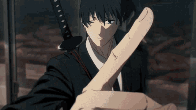 a man in a suit holds a sword in his left hand
