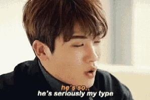 a young man is sitting on a couch and saying `` he 's so ... he 's seriously my type ''