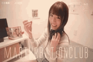 a woman is wearing headphones and smiling .