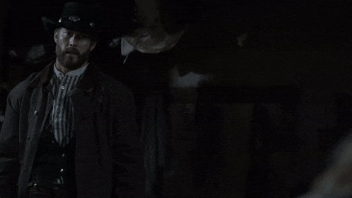a man in a cowboy hat says you know i 'll kill you in a dark room