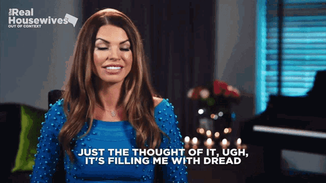 a woman in a blue dress says " just the thought of it ugh "