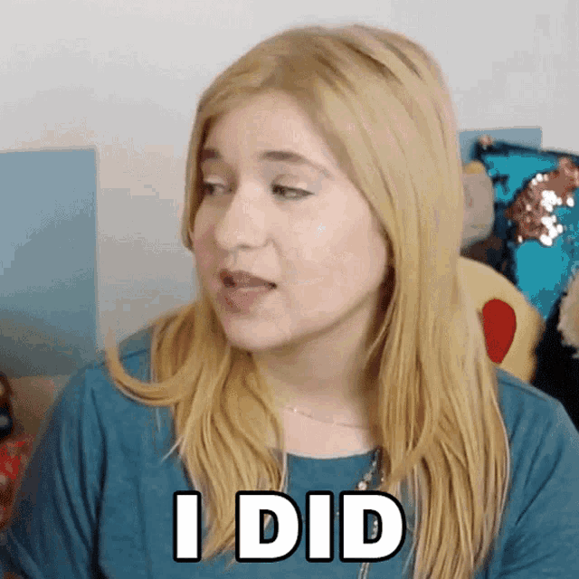 a blonde woman says i did in white letters