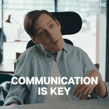 a man in a wheelchair with the words communication is key below him