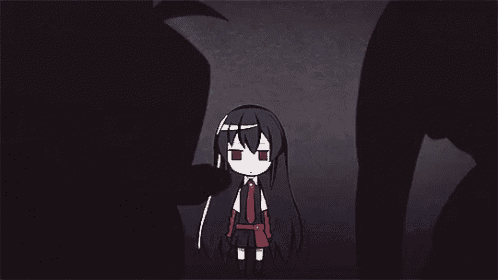 a little girl with long black hair is standing in the dark .