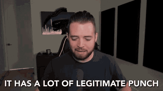 a man talking into a microphone with the words it has a lot of legitimate punch behind him