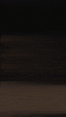 a blurred image of a person 's face with a light shining on it