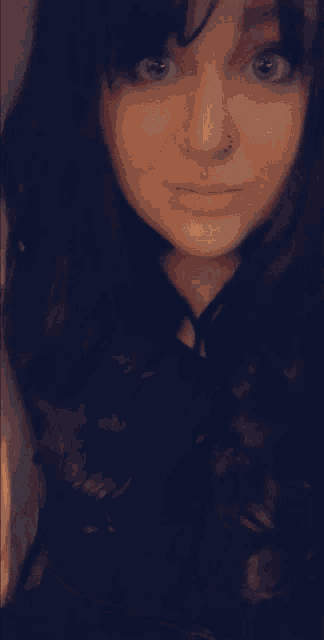 a woman with a nose ring is making a face