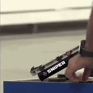 a person is holding a sniper gun in their right hand