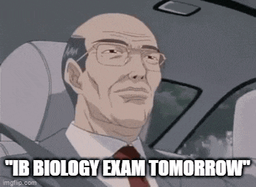 a man in a suit and tie is driving a car and says " ib biology exam tomorrow "