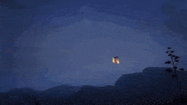 a man in a top hat stands in front of a rocket that is burning