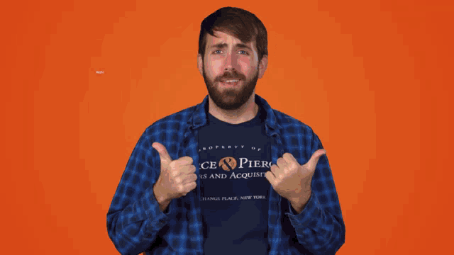 a man wearing a blue shirt that says property of pier