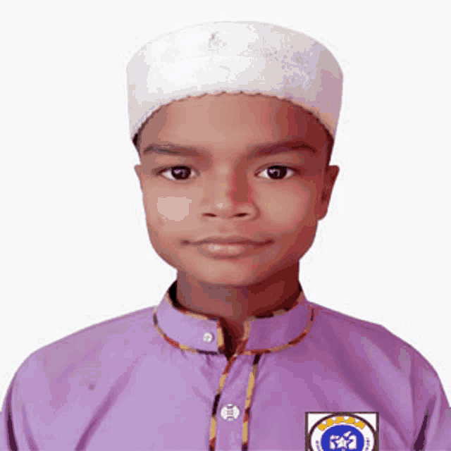 a young boy wearing a white hat and a purple shirt with a blue emblem on it