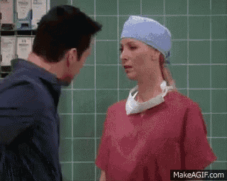 a man and a woman are looking at each other in a bathroom .