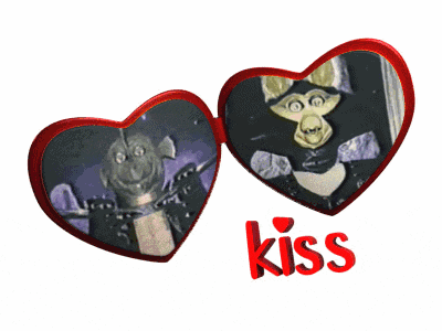two red hearts with a picture of a monkey and the word kiss on the bottom