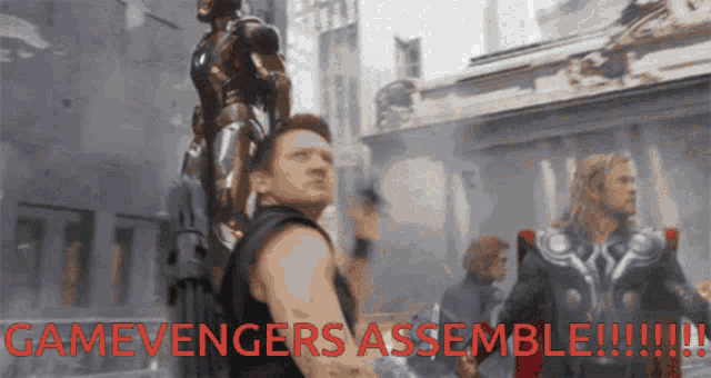 a man holding a gun with the words gamevengers assemble written below him
