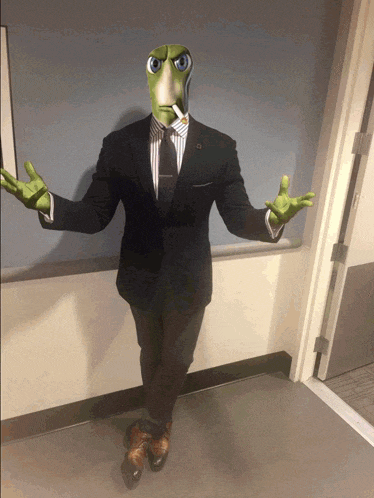 a man in a suit and tie with a lizard head