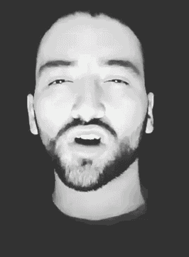 a man with a beard is shown in a black and white photo