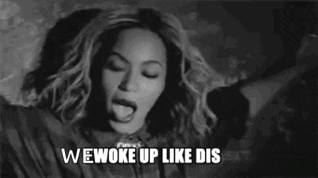 a black and white photo of a woman with the words `` we woke up like dis '' written on it .