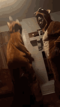 a person in a fox costume is standing in a room
