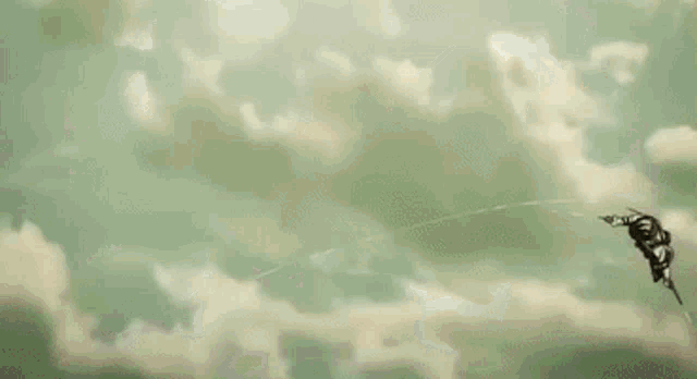 a man is flying through the air holding a sword .