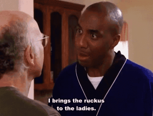 a man in a blue robe is talking to another man and says i brings the ruckus to the ladies .