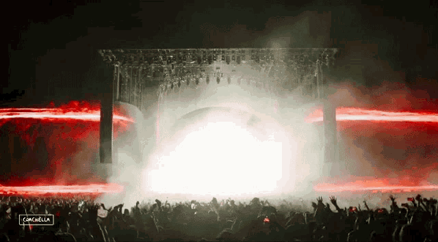 a crowd of people at a concert with the word cancella on the bottom right