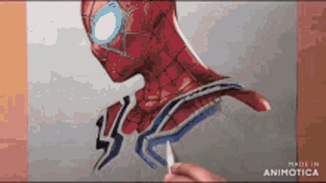a person is drawing a picture of spider man