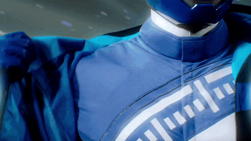 a close up of a person wearing a blue and white jacket
