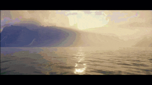 the sun is shining through the clouds over the ocean