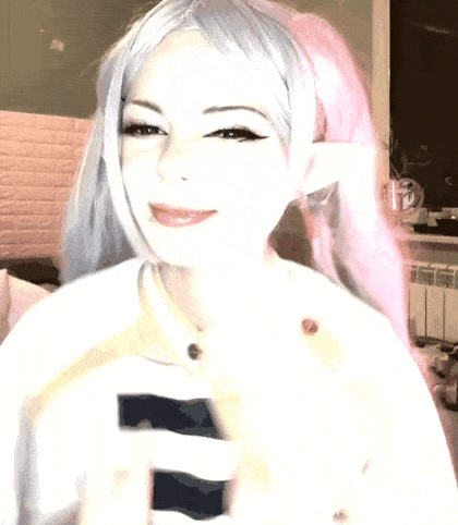 a girl with pink hair is wearing a white shirt with the letter s on it