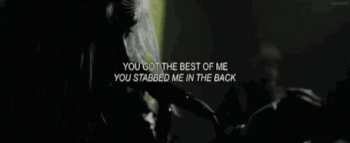 a woman is singing into a microphone in a black and white photo with a quote .