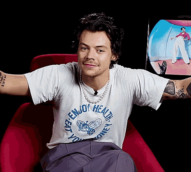 a man wearing a shirt that says enjoy health