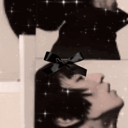 a picture of a woman with a black bow on it