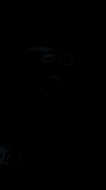 a blurry image of a person 's torso with a blue background