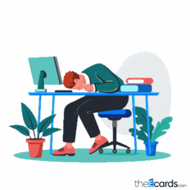 a man is sitting at a desk with his head on the desk and the words just bad day below him