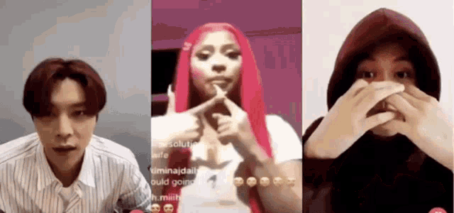 a woman with pink hair is making a heart with her fingers