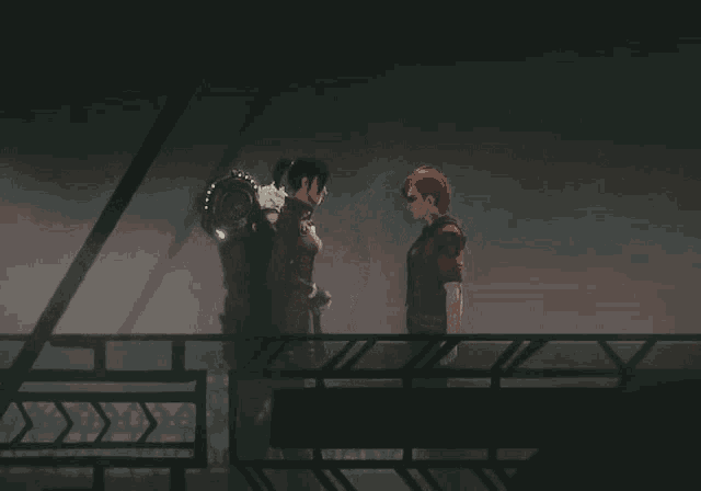 a couple of people standing on a balcony holding each other