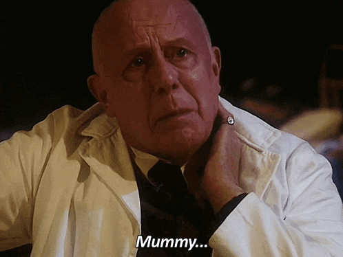 a bald man in a lab coat says mummy on the screen