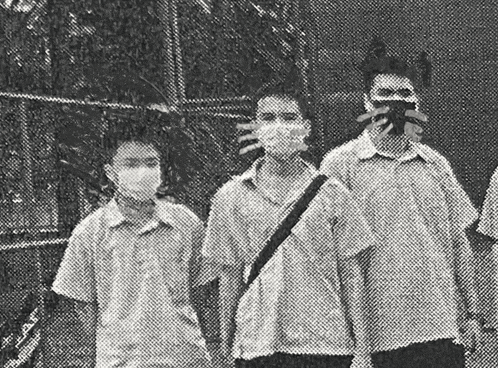 a group of people wearing face masks are walking in a black and white photo