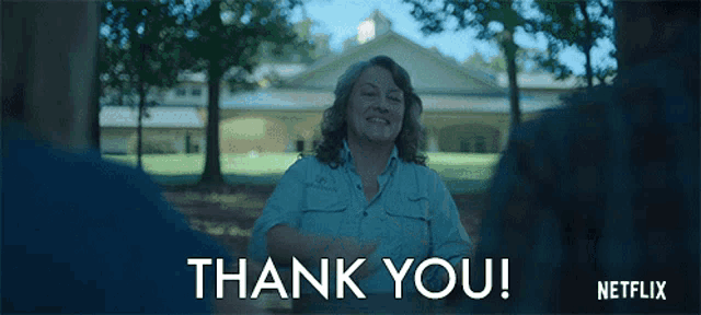 a netflix advertisement shows a woman sitting at a table and says thank you