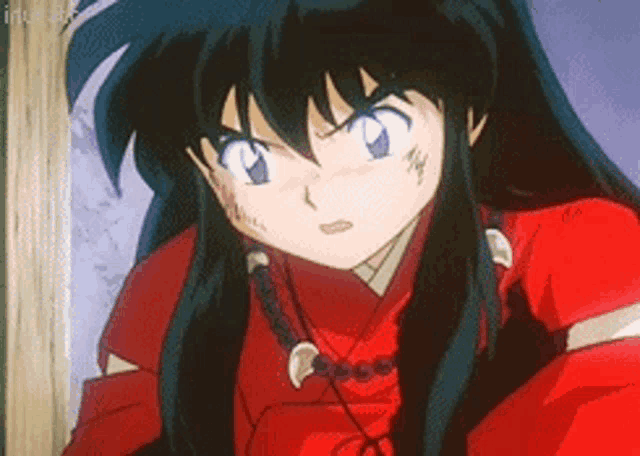 a close up of a cartoon character with long black hair wearing a red shirt and a necklace .