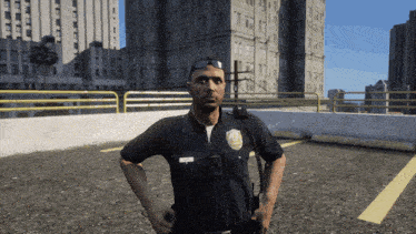 a police officer stands in a parking lot with his hands on his waist