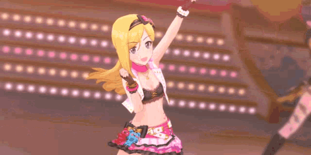 a girl in a pink dress is giving a peace sign in front of a crowd of people .