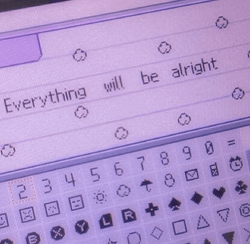 a close up of a purple keyboard with the words `` everything will be alright '' written on it .