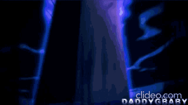 a video of a girl standing on a rock with the words clideo.com daddygbaby below it