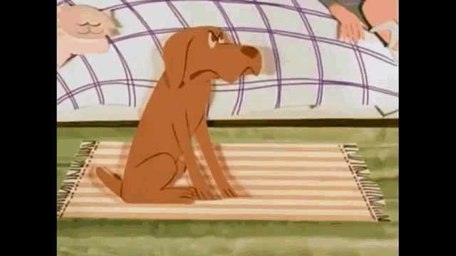 a cartoon dog is sitting on a striped rug in front of a bed .