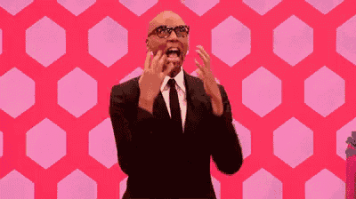 a man in a suit and tie is screaming in front of a pink background with hexagons