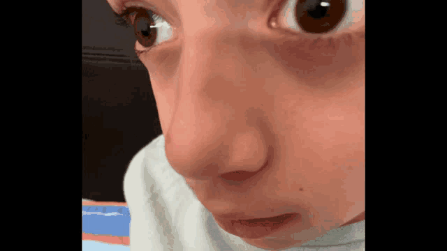 a close up of a person 's face with the number 4 on the bottom right