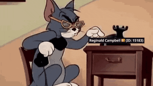 a cartoon of tom wearing sunglasses sitting at a table