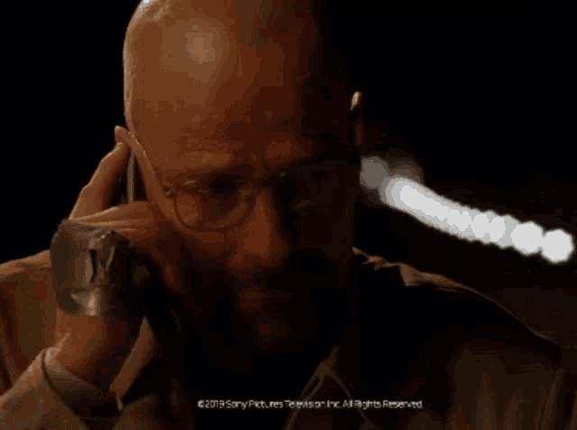 a man talking on a cell phone with the words " you 're never gonna see hank again " below him